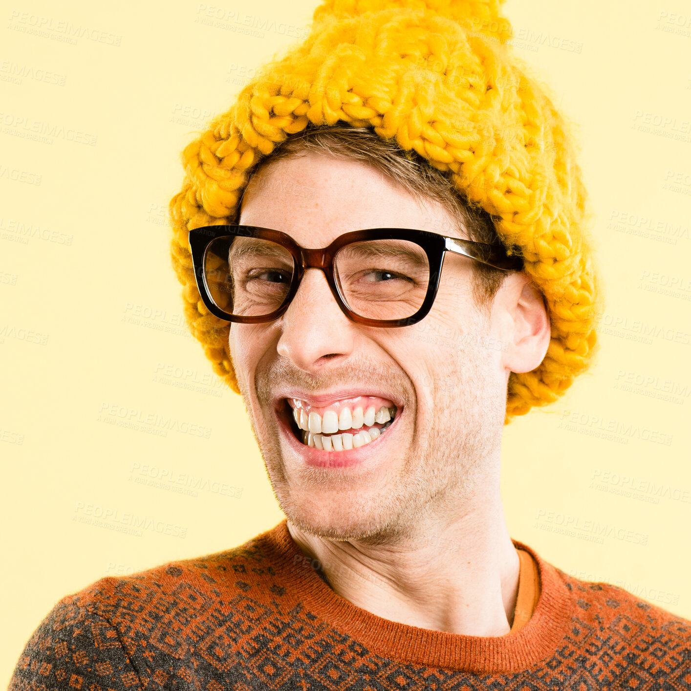 Buy stock photo Man, glasses and beanie for fashion in studio portrait with smile, confidence and pride by background. Person, nerd or geek with wool cap, excited and quirky style for winter with clothes in France