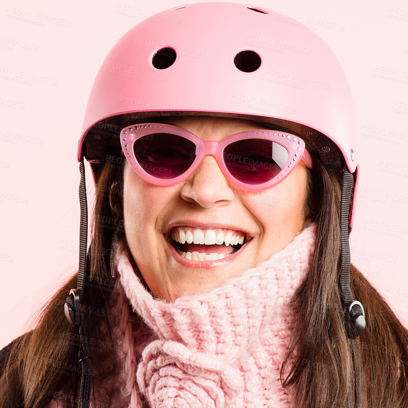 Buy stock photo Shot of a mature woman standing alone in the studio while wearing sunglasses and a helmet