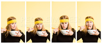 Buy stock photo Shot of an attractive young woman standing alone in the studio and eating with chopsticks