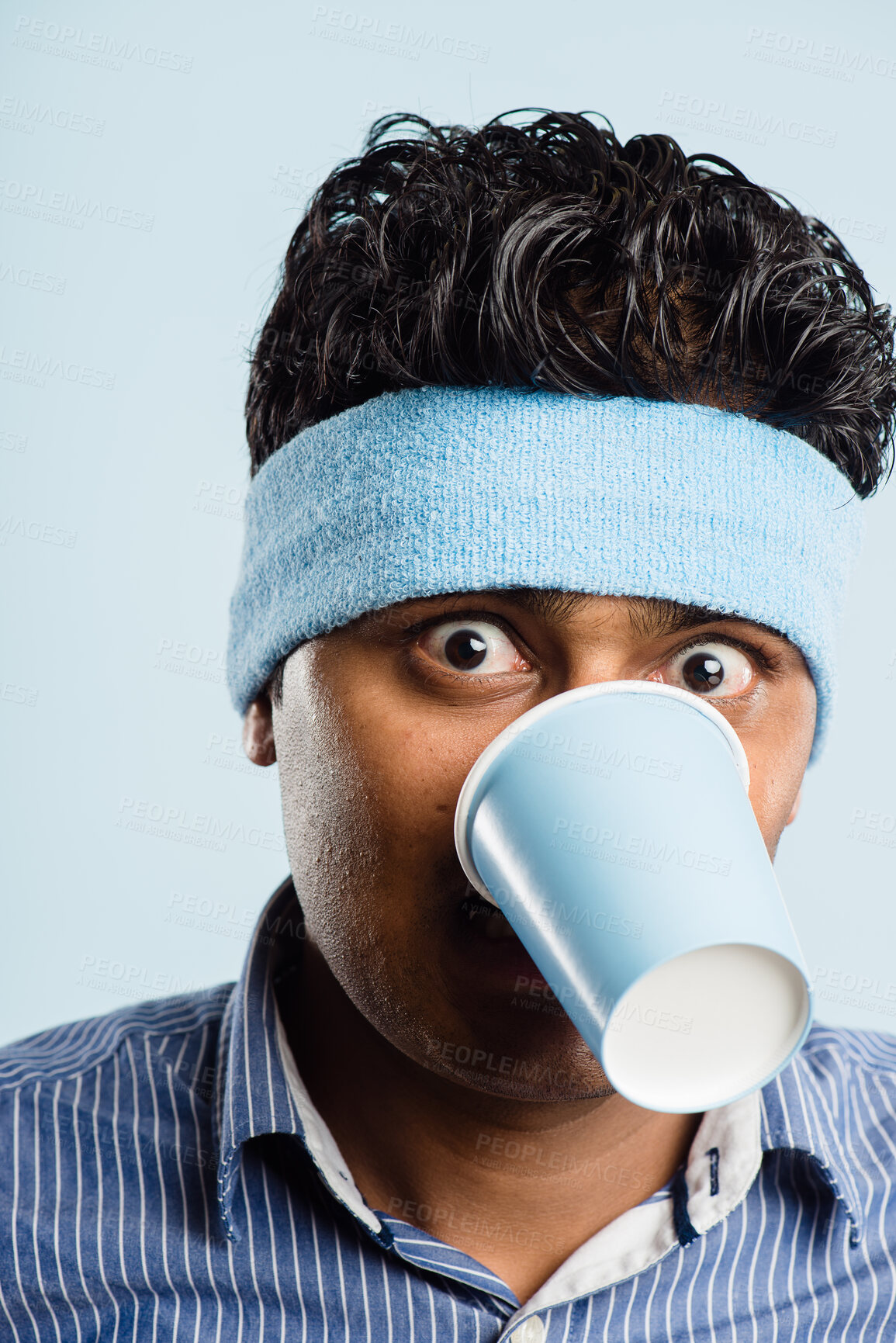 Buy stock photo Funny, crazy and portrait of man with coffee cup in studio for fitness with retro headband for workout. Caffeine, goofy and athlete drink takeaway cappuccino or latte with vintage exercise fashion.