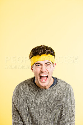 Buy stock photo Shouting, screaming and portrait of man on yellow background with anger, upset and crazy reaction. Body language, fashion announcement and isolated person with loud noise, voice and comic in studio