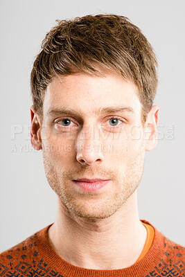 Buy stock photo Studio, serious and portrait of man, calm and confident for education, nerd and IT assistant in college. White background, proud and clothes for genius, relax and person with fashion, guy and unique