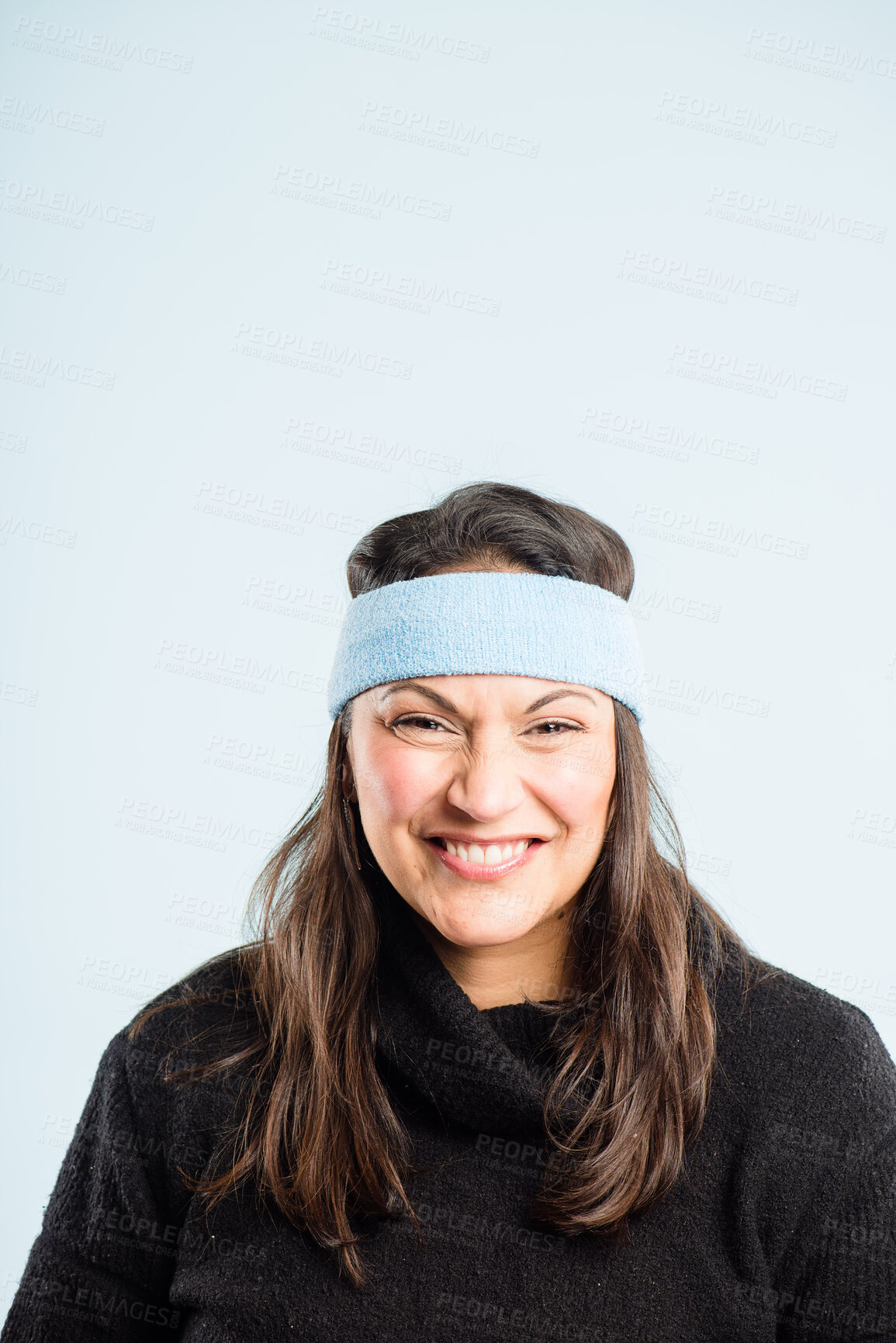 Buy stock photo Happy, smile and face of woman in studio with funny, comic or goofy facial expression. Playful, comedy and portrait of crazy young female model with silly personality isolated on blue background