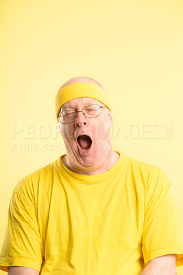 Buy stock photo Studio, tired and man with yawning for fitness, exercise workout and exhausted by yellow background. Model, mature person and burnout with low energy for cardio, sleepy and headband by mockup space