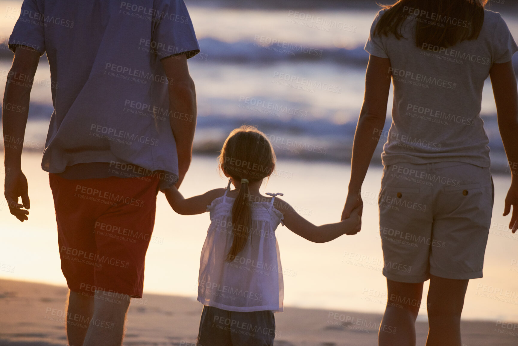 Buy stock photo Walk, child and parents holding hands on beach for fun, travel holiday and bonding together on tropical adventure. Mom, dad and girl on family vacation with ocean, support and island summer from back