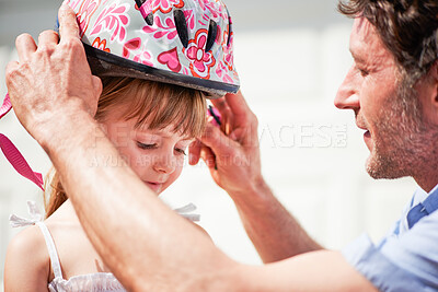 Buy stock photo Bicycle, helmet and child with support of father for protection, guidance and teaching on weekend. Family, love and man helping little girl with cycling gear for development, adventure and safety