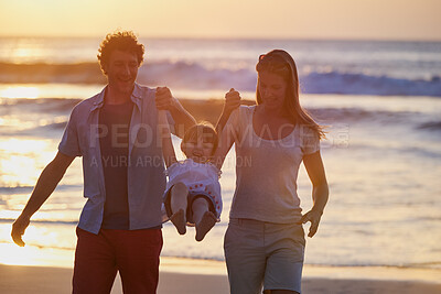 Buy stock photo Play, girl and parents holding hands on beach for fun, travel holiday and bonding together on tropical adventure. Mom, dad and child on happy family vacation with ocean, support and island sunset