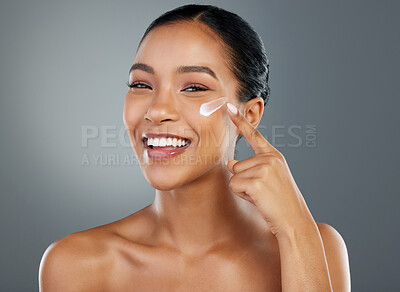 Buy stock photo Woman, portrait and cream with beauty in studio for collagen treatment, skin hydration and skincare. Mockup, happy and cosmetics product with hyaluronic acid, retinol and wellness on gray background