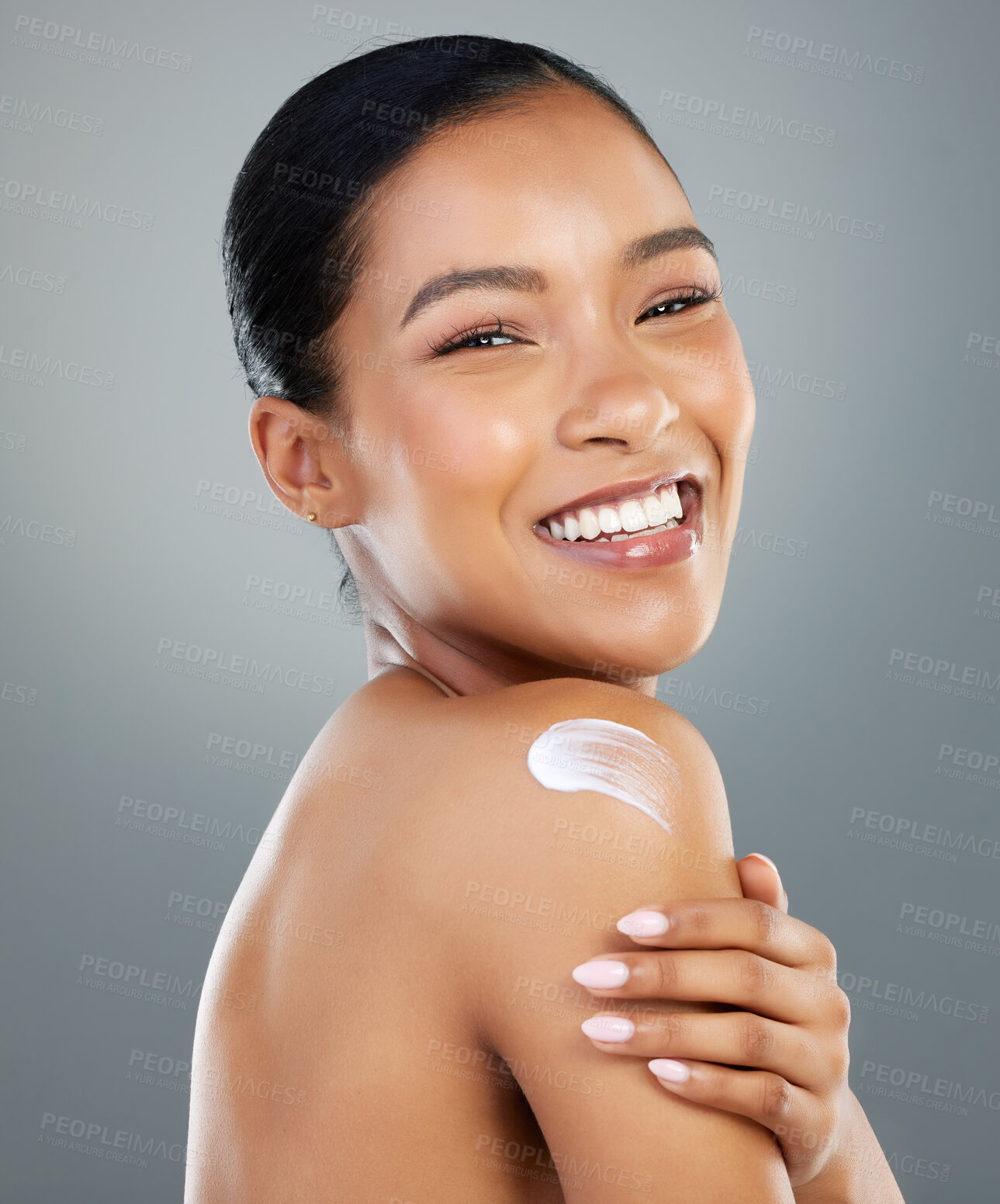 Buy stock photo Woman, skincare and cream on shoulder in studio portrait with smile, process and beauty by background. Girl, person and model with touch for cosmetics, lotion and serum for transformation in Colombia