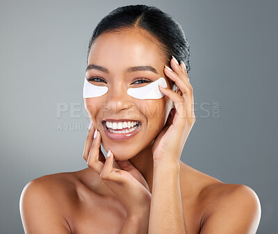 Buy stock photo Woman, skincare and eye patch in studio portrait with process, test and wellness by background. Girl, model and person with cosmetics, dermatology and happy with facial transformation in Costa Rica