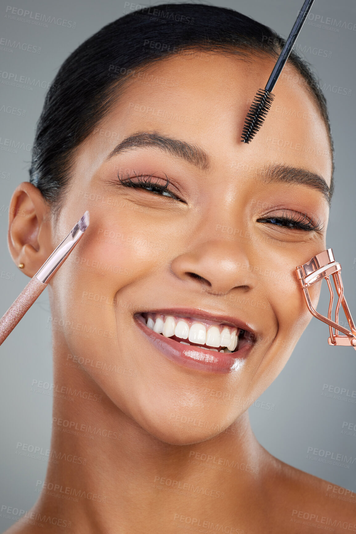 Buy stock photo Woman, portrait and makeup tools in studio, skincare and cosmetic transformation on gray background. Female person, beauty and curler for lashes or grooming, dermatology and treatment application 