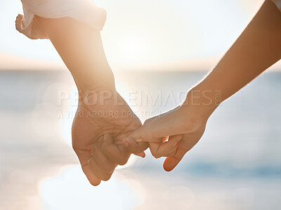 Buy stock photo Holding hands, happy couple and beach on vacation, honeymoon or holiday for romance or relationship. People, care and love with support, travel and connection in marriage together for sunset or relax