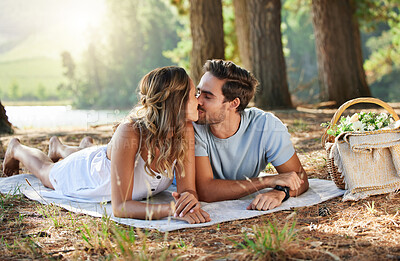 Buy stock photo Couple kiss, love and picnic in forest, summer with freedom and adventure, relationship with affection and care outdoor. People together in nature park, commitment and trust with romance and bonding