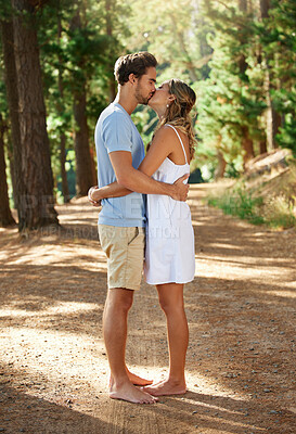 Buy stock photo Couple kiss, love and hug in forest, summer with freedom and adventure, relationship with affection and care outdoor. People together in nature park, commitment and trust with romance and bonding
