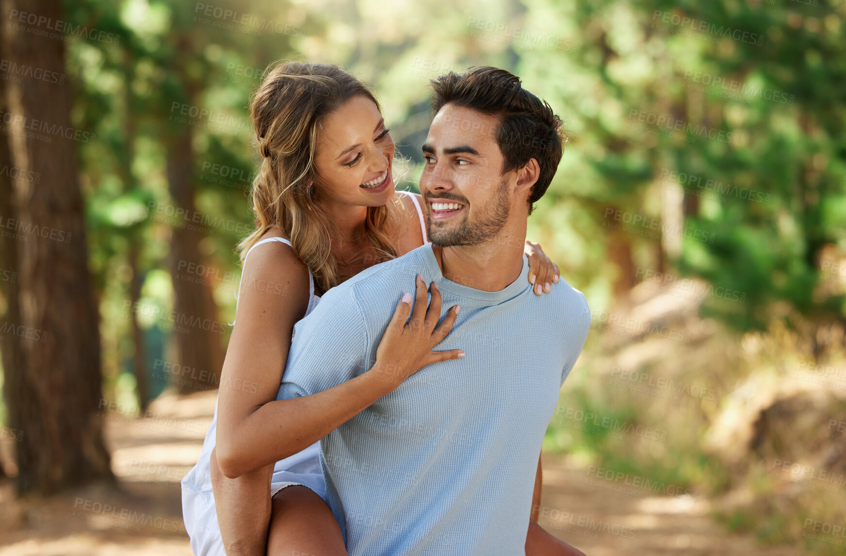 Buy stock photo Couple in nature park, piggy back and happy relationship with love and trust, travel and adventure outside. Young people in forest, outdoor and happiness together with smile, commitment and hug