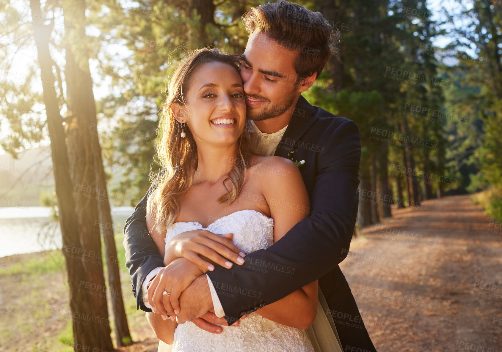 Buy stock photo Wedding, love and couple hug in park, forest and nature for celebration of union, care and marriage commitment. Portrait of happy bride, groom and hugging in garden for romance, partner and happiness