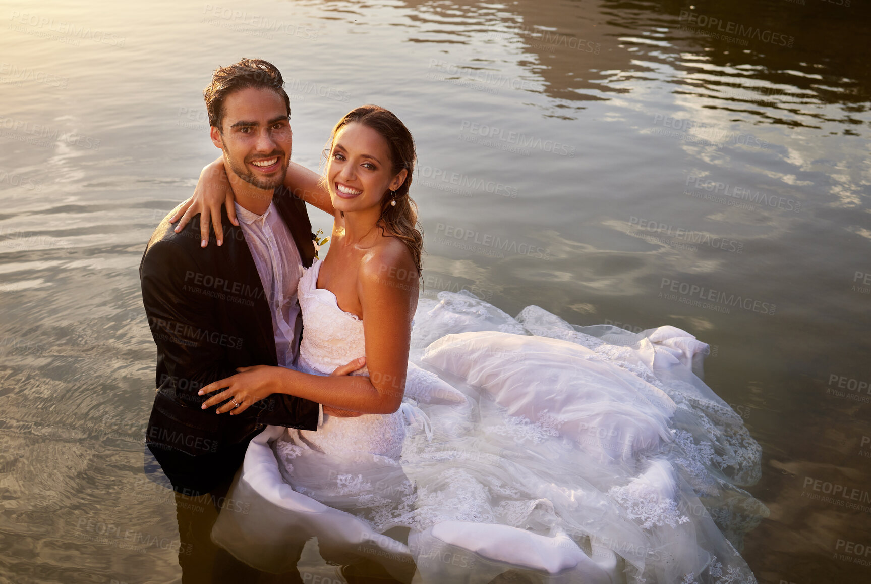 Buy stock photo Wedding, love and portrait of couple in the lake to celebrate their marriage in nature. Happy, smile and young wet bride and groom swimming in the pond water for romantic playful outdoor celebration.