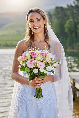 Buy stock photo Portrait, bride and smile with flower bouquet at lake, nature and celebration of commitment, love and marriage. Happy woman, wedding and flowers outdoor for bridal fashion, style and excited ceremony