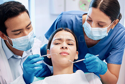 Buy stock photo Shot of a young woman looking unsure in her dentists office