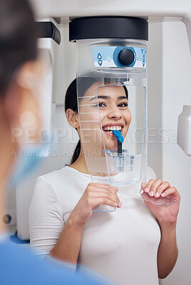 Buy stock photo Shot of a young woman getting her teeth scanned for a mold at the dentists office