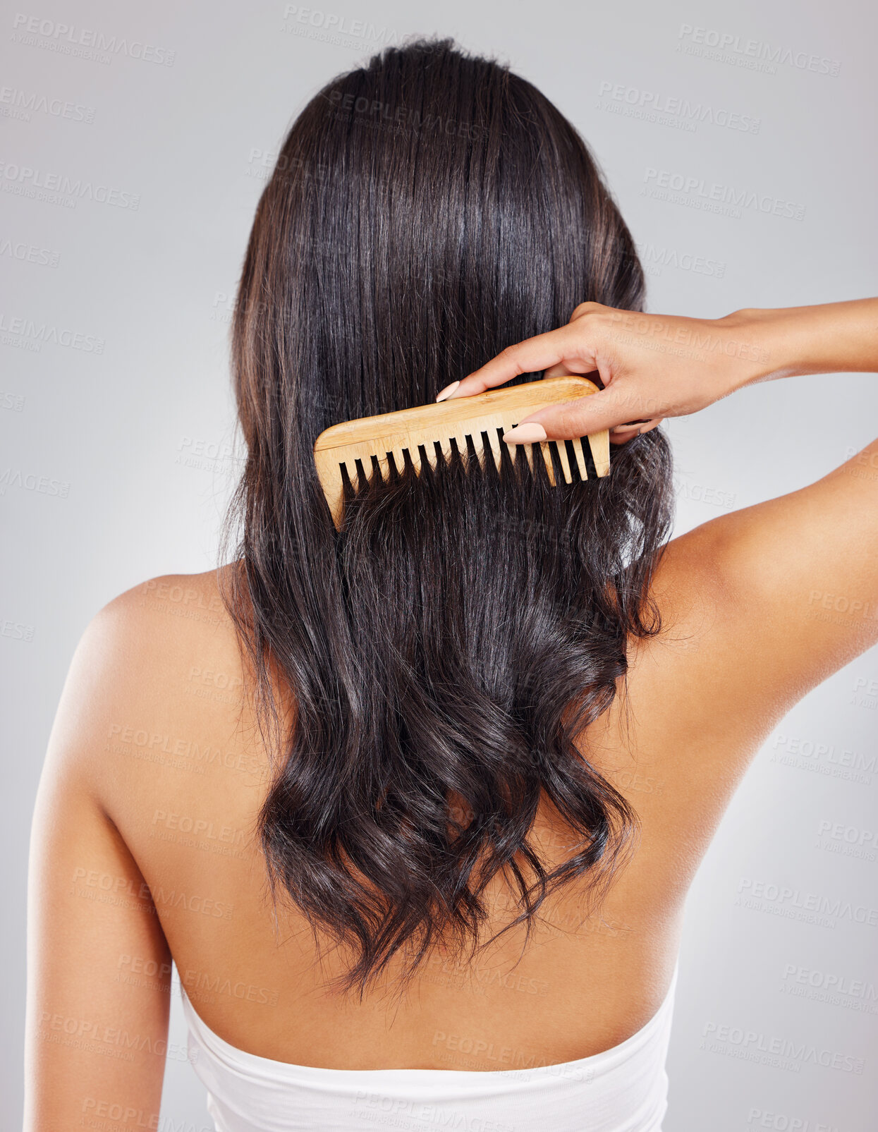 Buy stock photo Hair, back and woman in studio with comb for grooming, hairstyle or satisfaction on white background. Rear view, brush and hand of female model for healthy texture, growth or salon treatment