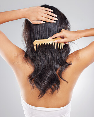 Buy stock photo Hair care, back and woman in studio with comb for frizz problem, hairstyle or split ends on white background. Rear view, damaged and hands of female model for hairloss, salon stress or tangle strand