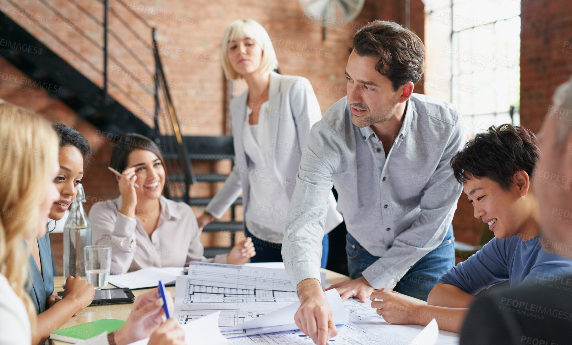 Buy stock photo Engineering, architecture and team working with blueprint for industrial project in office. Meeting, teamwork and group of industry workers planning construction sketch in collaboration in workplace.