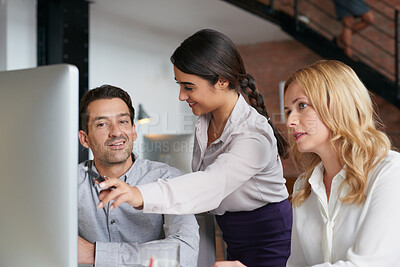 Buy stock photo Meeting, collaboration and explain with a business woman and team talking while working on a computer together. Teamwork, planning and strategy with a female employee helping a colleague in an office