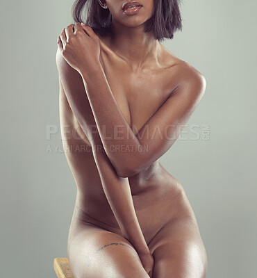 Buy stock photo Studio shot of a gorgeous young woman posing nude against a grey background
