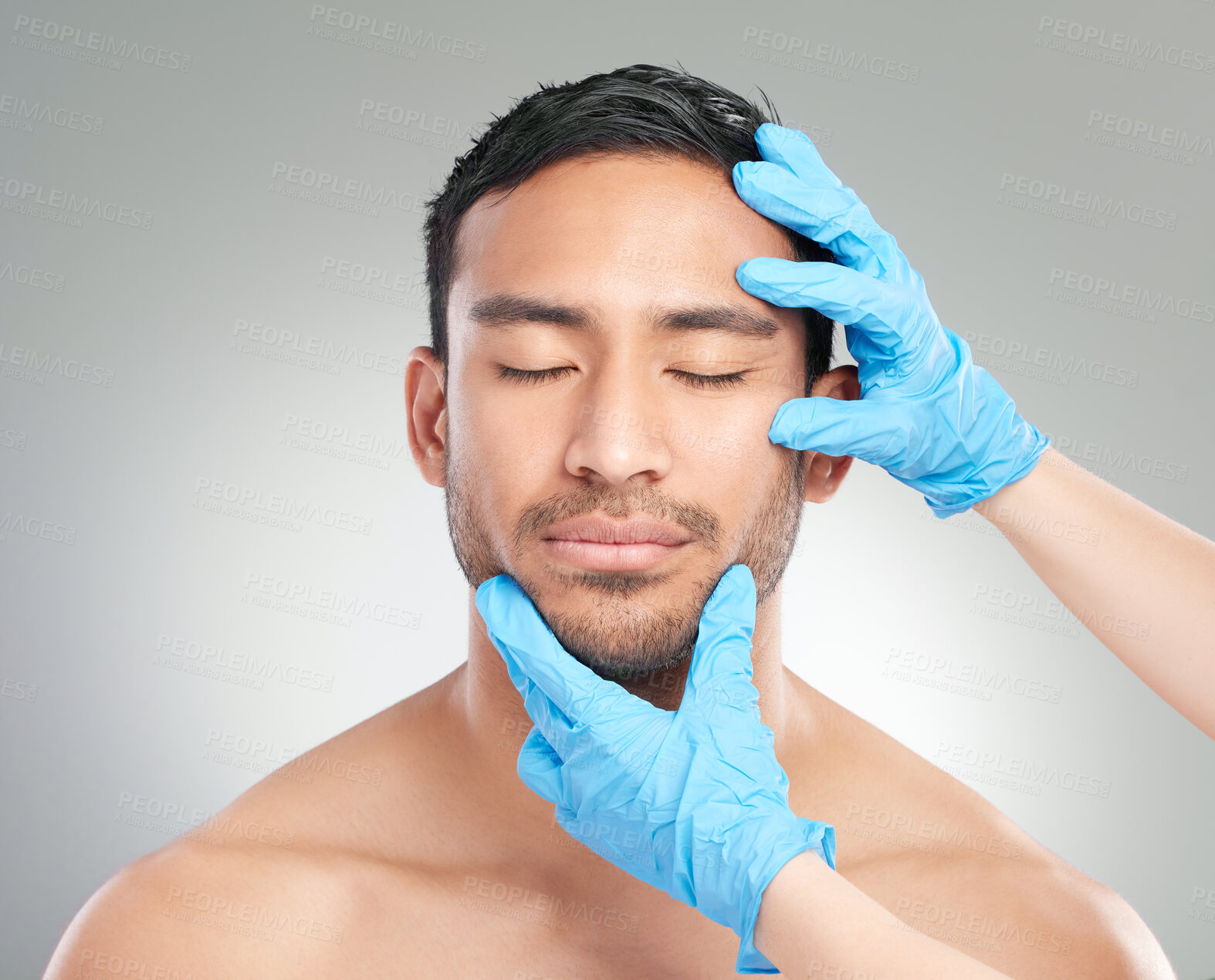 Buy stock photo Man, doctor and hands with plastic surgery for medical, skincare or facial treatment on a white studio background. Face of male person with surgeon gloves for reconstruction, cosmetology or beauty