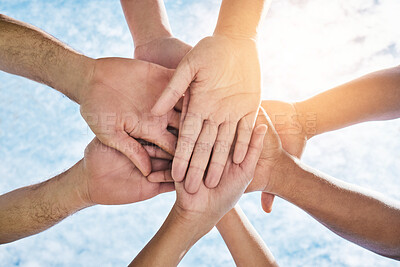 Buy stock photo Hands in circle together, blue sky and community in collaboration for world support, trust and diversity. Teamwork, hand and summer sunshine, positive mindset and group of people in solidarity huddle