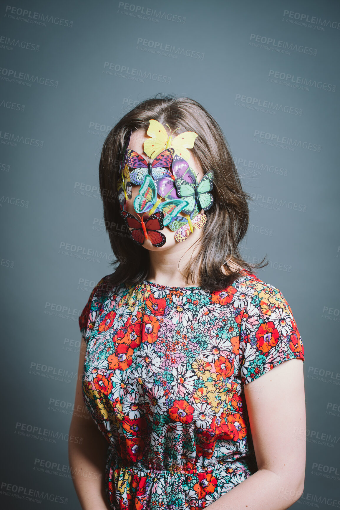 Buy stock photo Woman, butterfly mask and art in studio for protection of endangered species by blue background. Person, artist and cover face with insect for sustainability with eco friendly fashion for spring