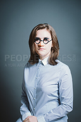 Buy stock photo Woman, funny and fake glasses for mask, cosplay and halloween photo booth with portrait in studio. Female person, quirky and disguise on gray background for character, persona and birthday event