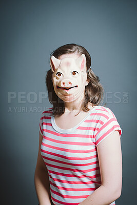 Buy stock photo Studio, portrait and woman with pig mask for character, facade and cosplay with pride for halloween. Female person,  creativity and ready by gray background for persona, animal theme and costume