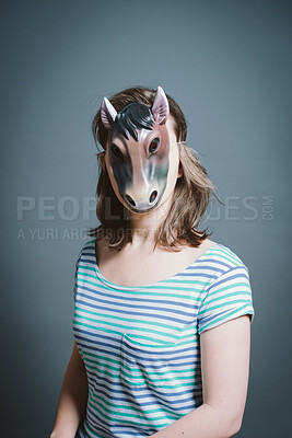 Buy stock photo Studio, portrait and person with horse mask for character, facade and cosplay with pride for halloween. Woman model,  creativity and fantasy by gray background for persona, animal theme and costume