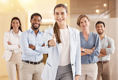 Buy stock photo Portrait of a young businesswoman extending a handshake in an office with her colleagues in the background