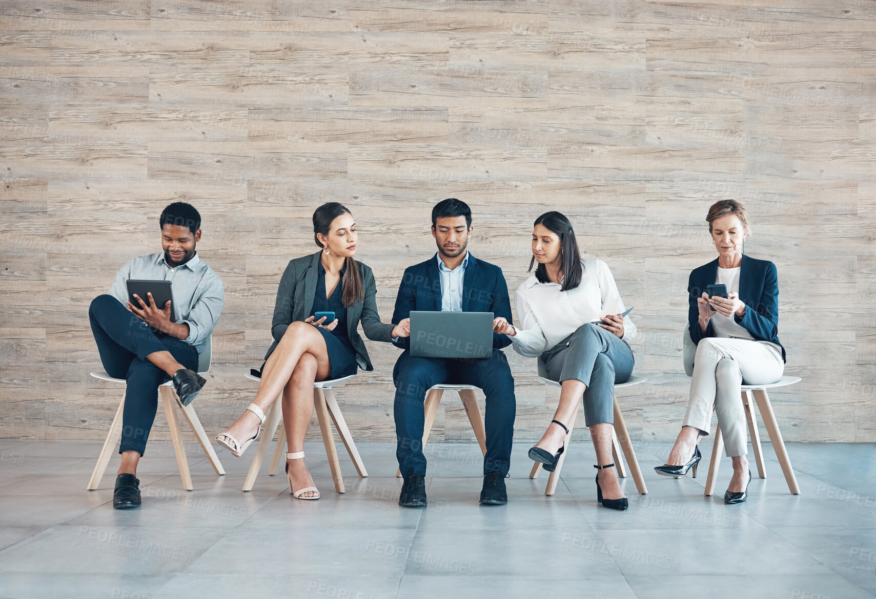 Buy stock photo Business people, recruitment or working in office with tech for interview, collaboration with onboarding on chair. Group, row or corporate company with staff diversity for hr, inclusion or teamwork