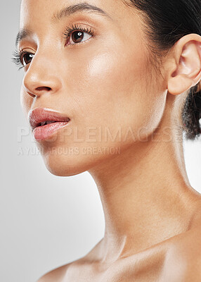 Buy stock photo Studio shot of an attractive young woman posing against a grey background