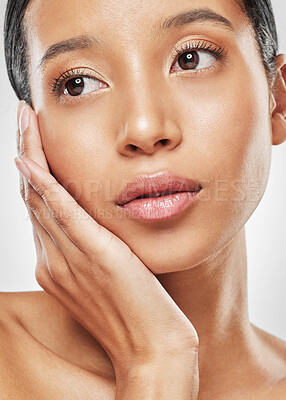 Buy stock photo Studio shot of an attractive young woman posing against a grey background