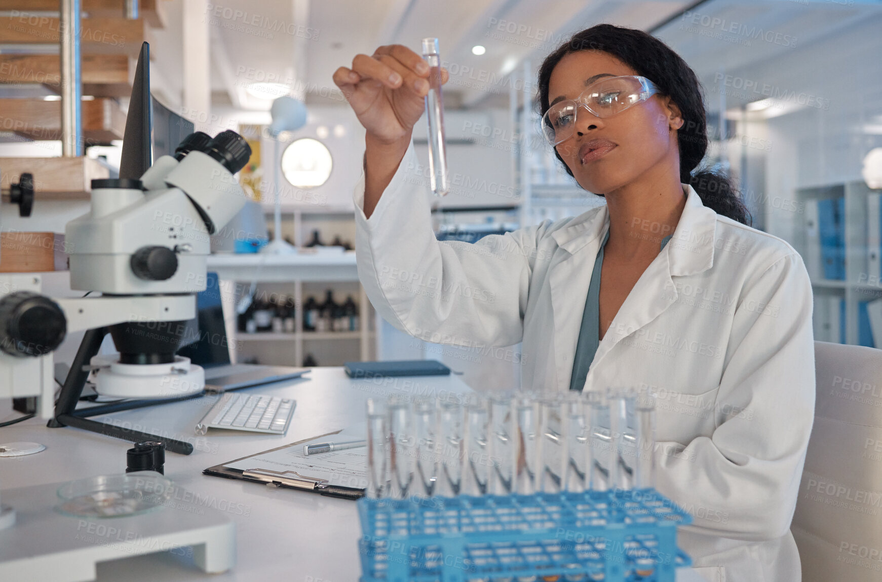 Buy stock photo Scientist, test tube and science in lab for research, biotechnology or monkeypox vaccine development. Black woman, healthcare and chemistry study for stem cell, genes editing or microbiome innovation