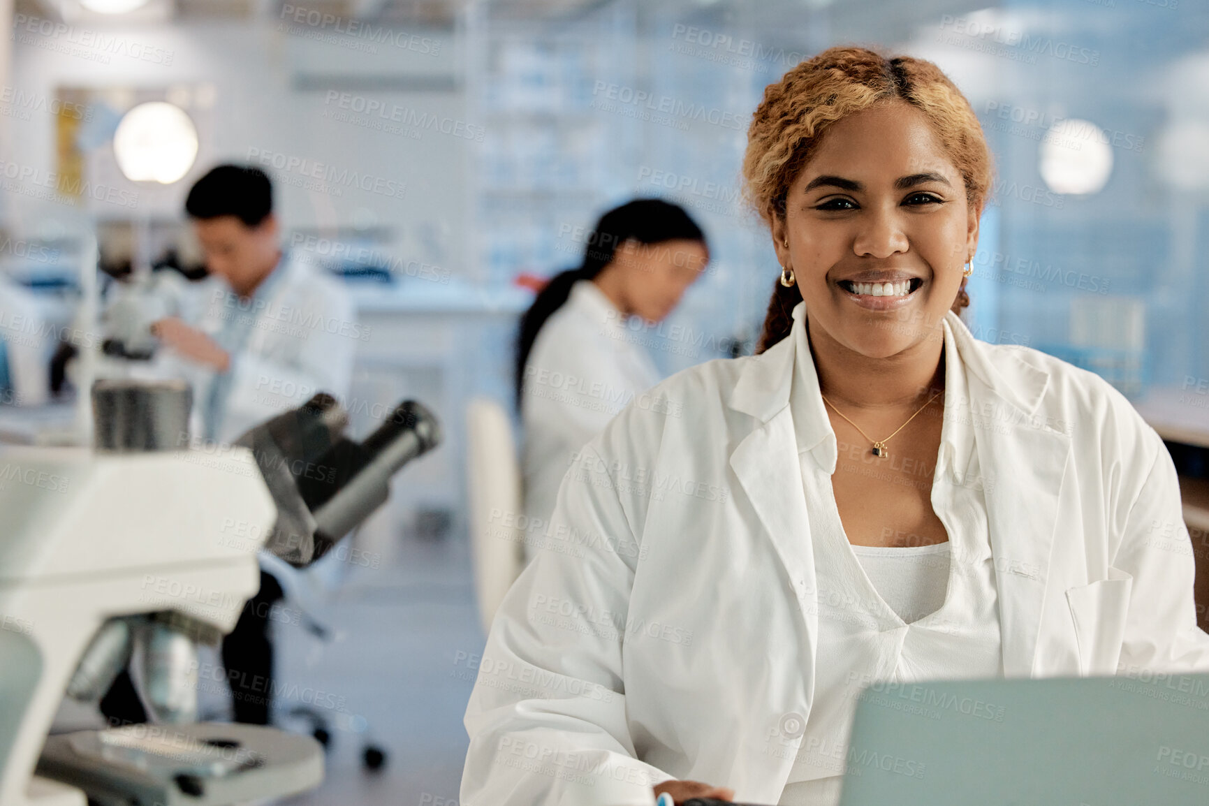 Buy stock photo Portrait, happy and woman in lab for science, healthcare and biotechnology at microscope. Medical engineer, smile and tech in research facility for microbiology, vaccine development or researcher