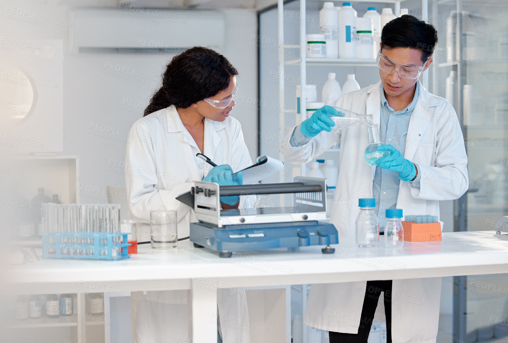 Buy stock photo Scientist, container and collaboration in lab for research, biotechnology or healthcare vaccine development. Teamwork, medicine and cancer study for stem cell, genes editing or microbiome innovation