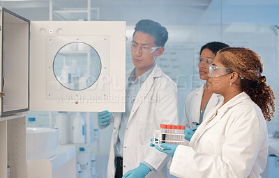 Buy stock photo Centrifuge, healthcare and team of people in laboratory for science, medical and research breakthrough. Mpox deadline, pharmacy and study with scientist for medicine, biotechnology and vaccine