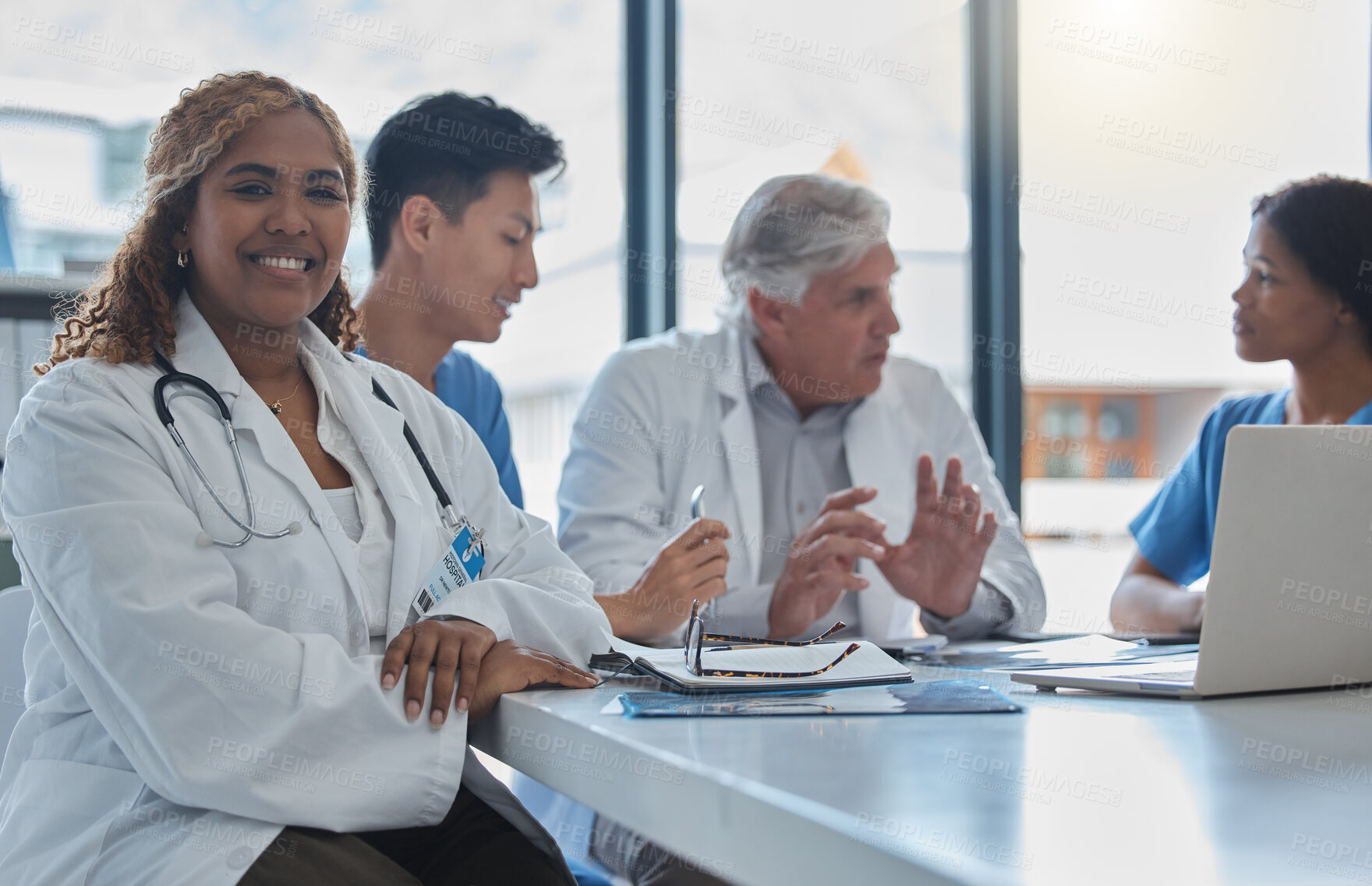 Buy stock photo Cropped portrait of an attractive young female nurse sitting in the hospital boardroom during a meeting