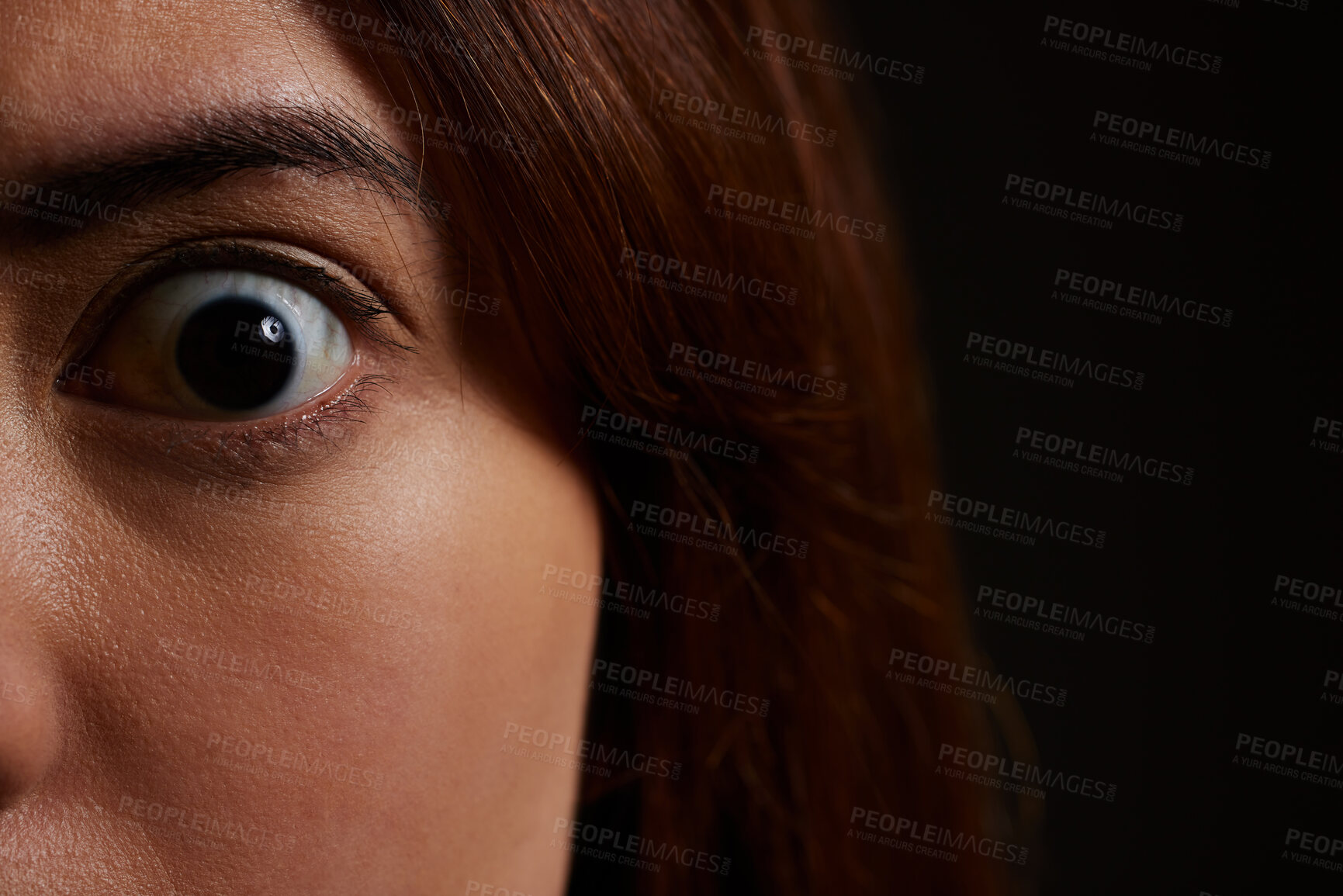 Buy stock photo Woman, portrait and eye with shock in horror for fear, trauma or mental illness in asylum or studio on a black background. Closeup, face and scare with nightmare for spooky despair, paranoid or panic