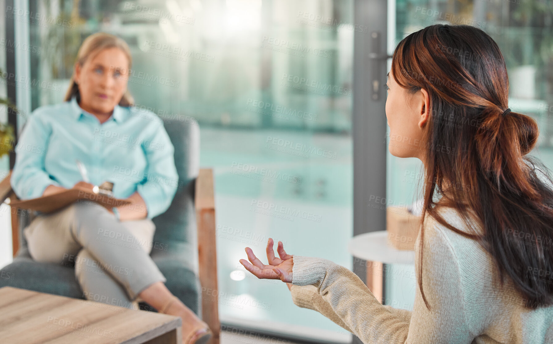 Buy stock photo Talking, woman and therapist in office for consultation, mental health and client for anxiety support. Therapy, female psychologist or patient on sofa for counseling, share trauma or notes in session