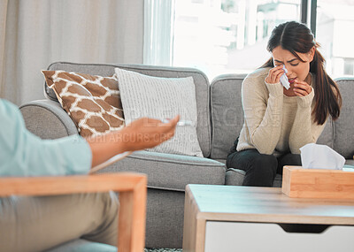 Buy stock photo Shot of a young woman crying during a consultation with her therapist