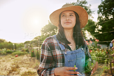 Buy stock photo Shot of a female farmer stand on a farm