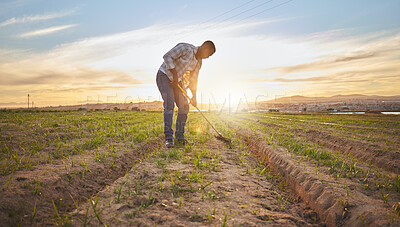 Buy stock photo Shot of a farmer working on a field