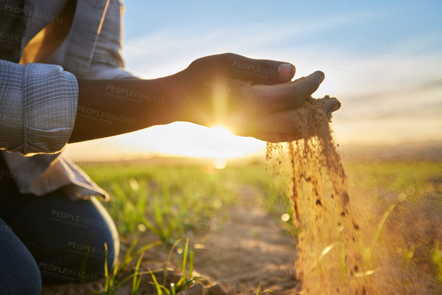 Buy stock photo Cropped shot of a farmer holding soil